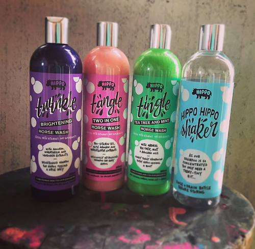Four bottles of Hippo products on a textured surface