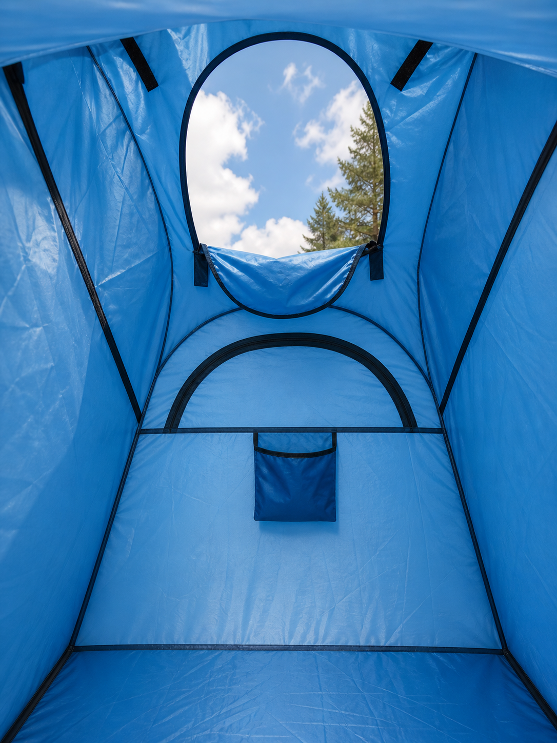 Blue pop-up tent with a clear view of the sky and trees