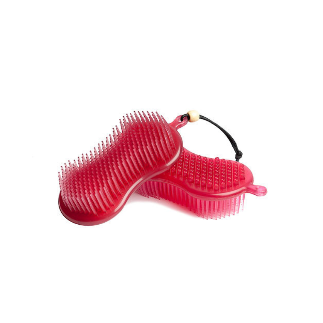 Red silicone grooming brush on a white background
